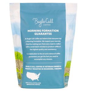 back view of blue coffee bag with image of sky and water
